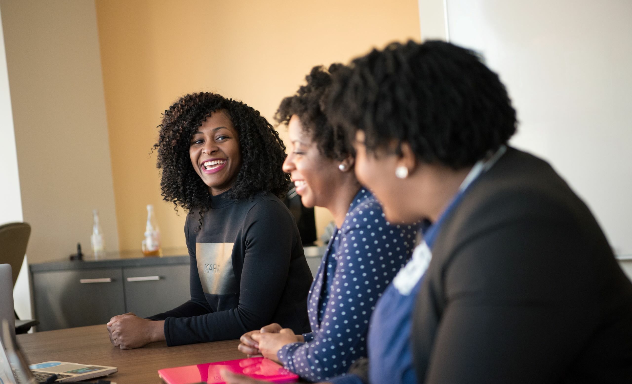 three women smiling