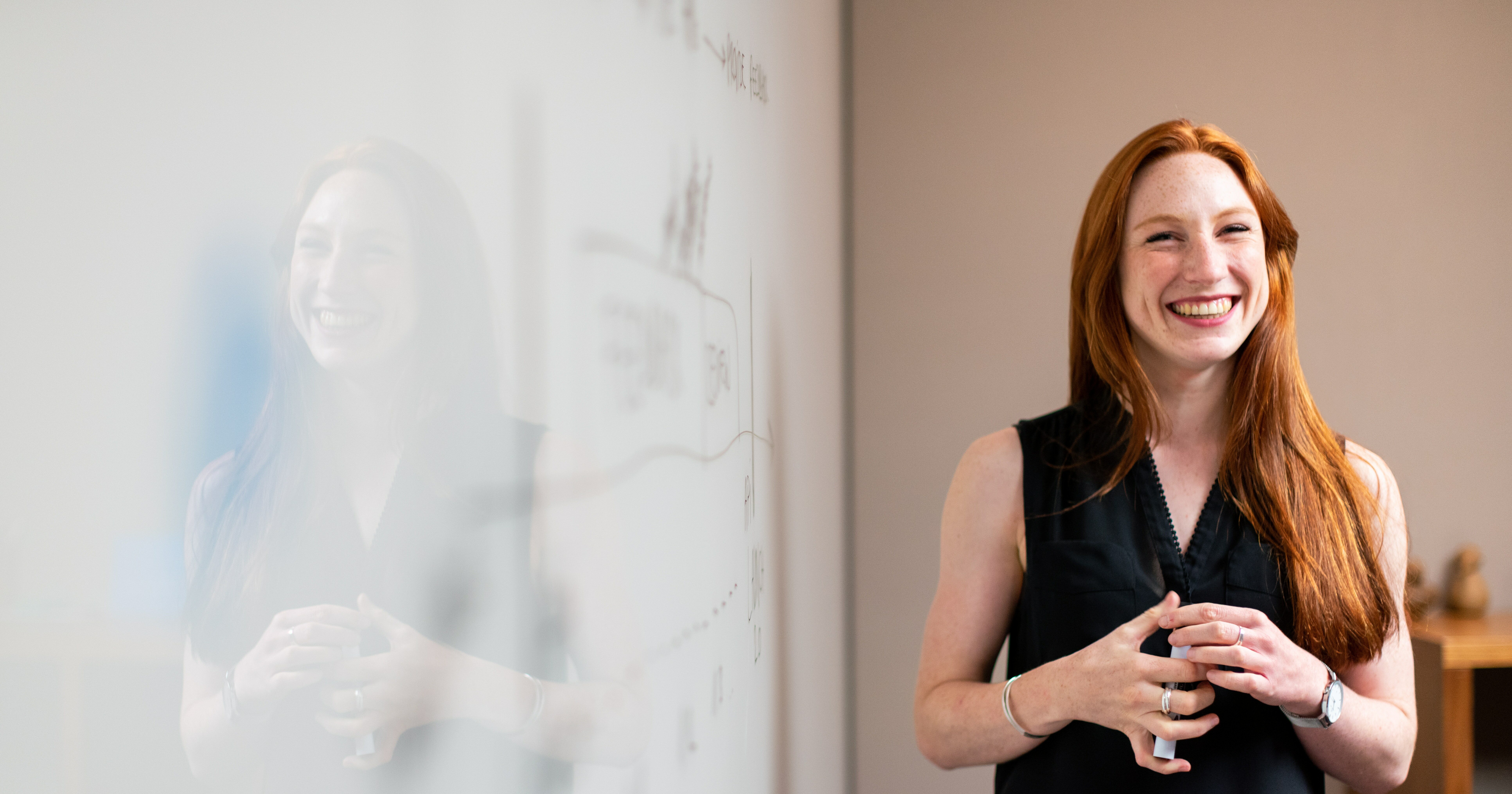 picture of a trainer standing by a whiteboard