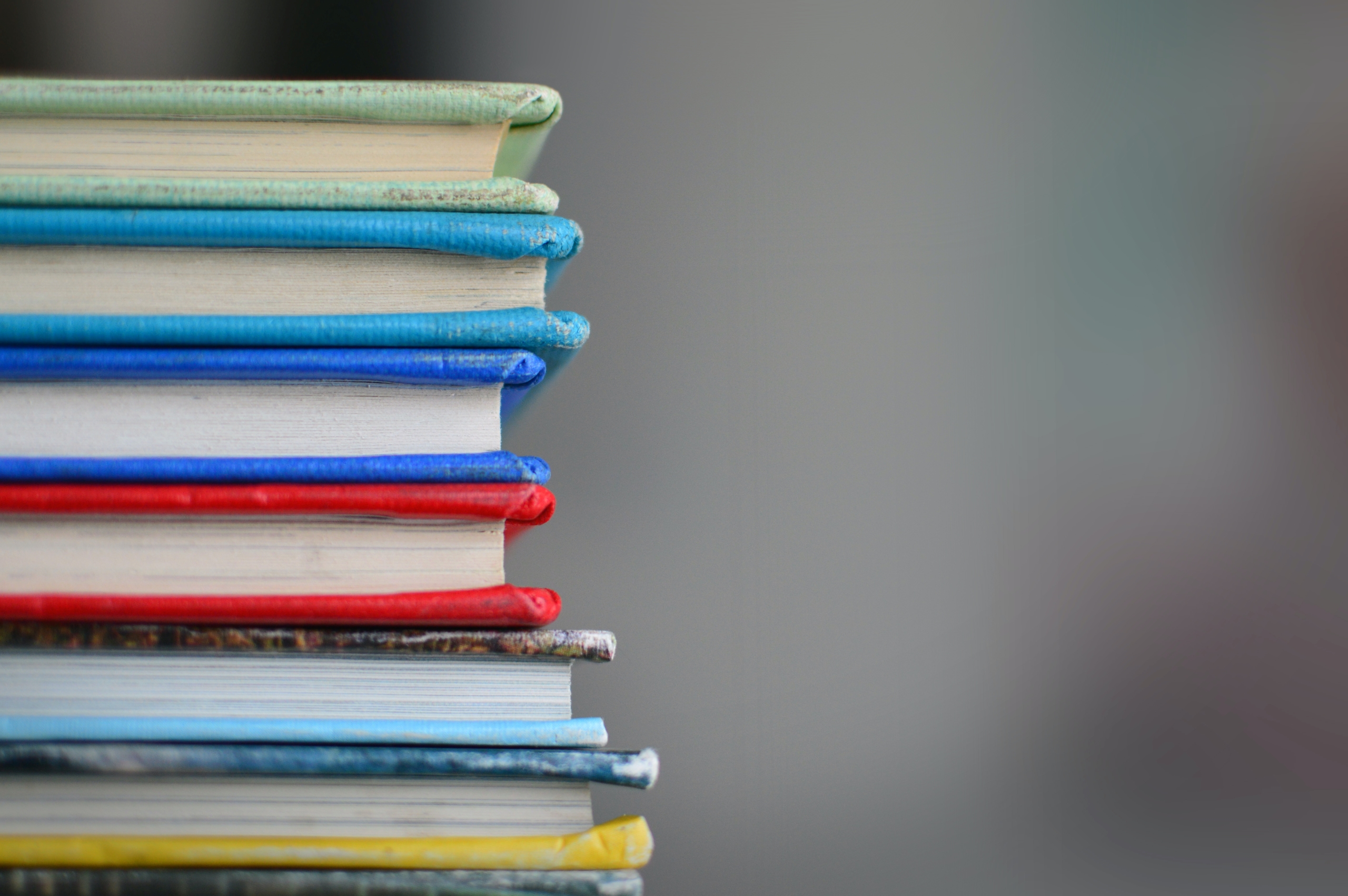 a stack of books in different colours