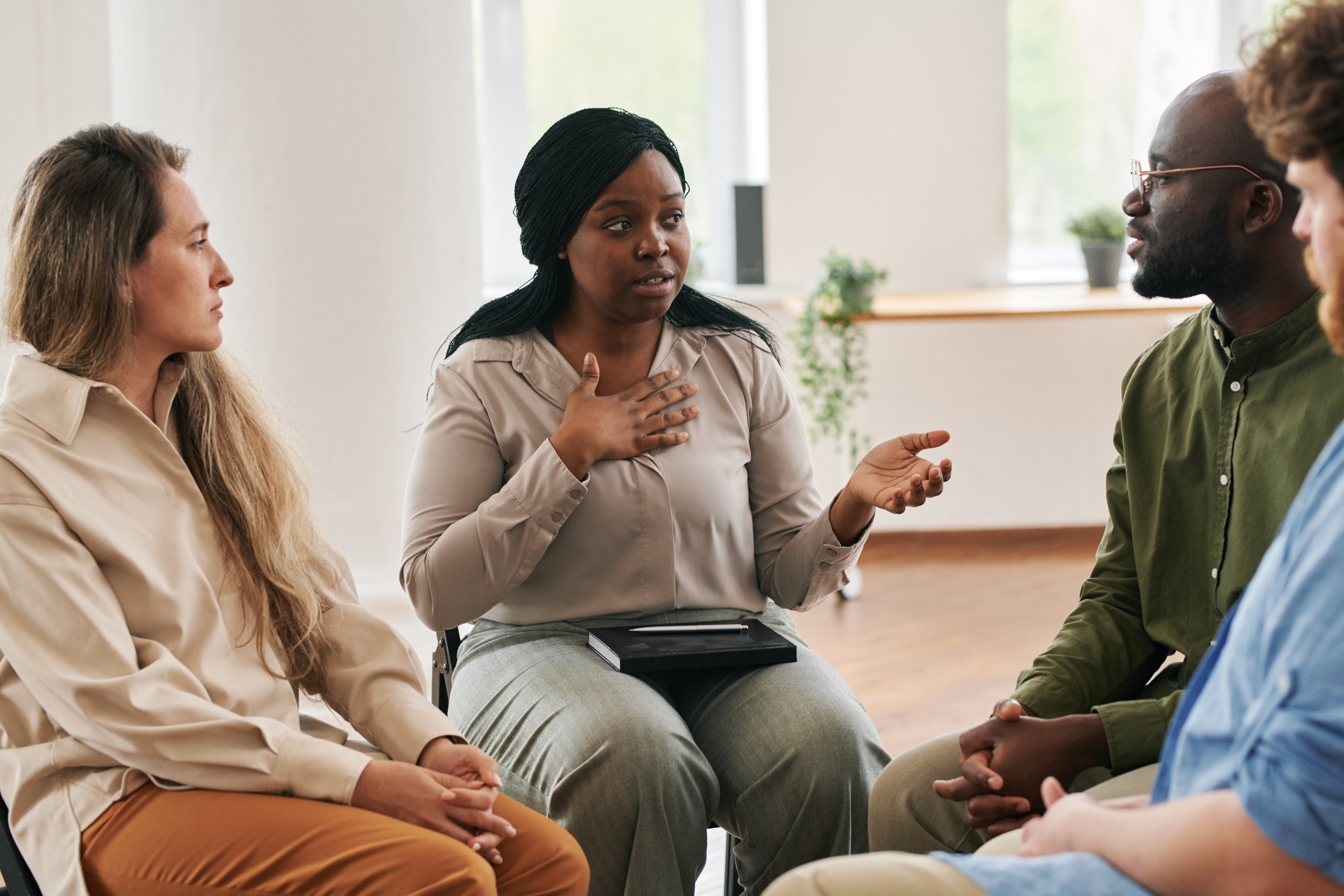 woman talking to a group of people